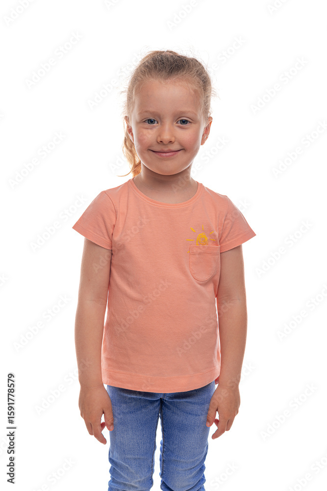 Portrait of a cheerful young girl in a casual orange t-shirt and jeans, standing and smiling confidently against a white background, ideal for concepts of childhood, happiness, and simplicity. Portrait of a cheerful young girl in a casual orange t-shirt and jeans, standing and smiling confidently against a white background, ideal for concepts of childhood, happiness, and simplicity.