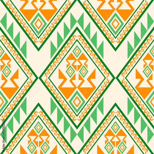 Geometric pattern featuring green triangles and orange diamond shapes in a repeating design on a pale cream background