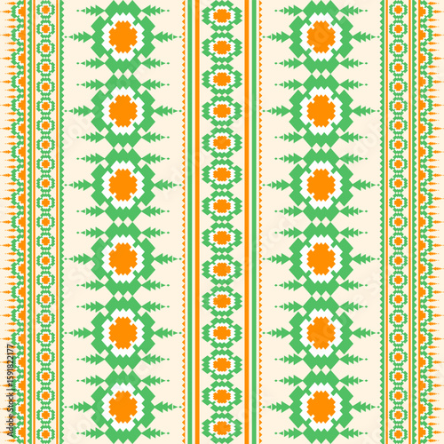 Seamless ethnic pattern featuring orange green and white geometric shapes against a light tan background The pattern