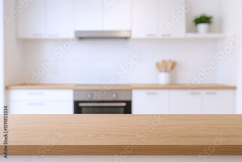 Modern minimalist kitchen interior with white cabinets and wooden countertop design.