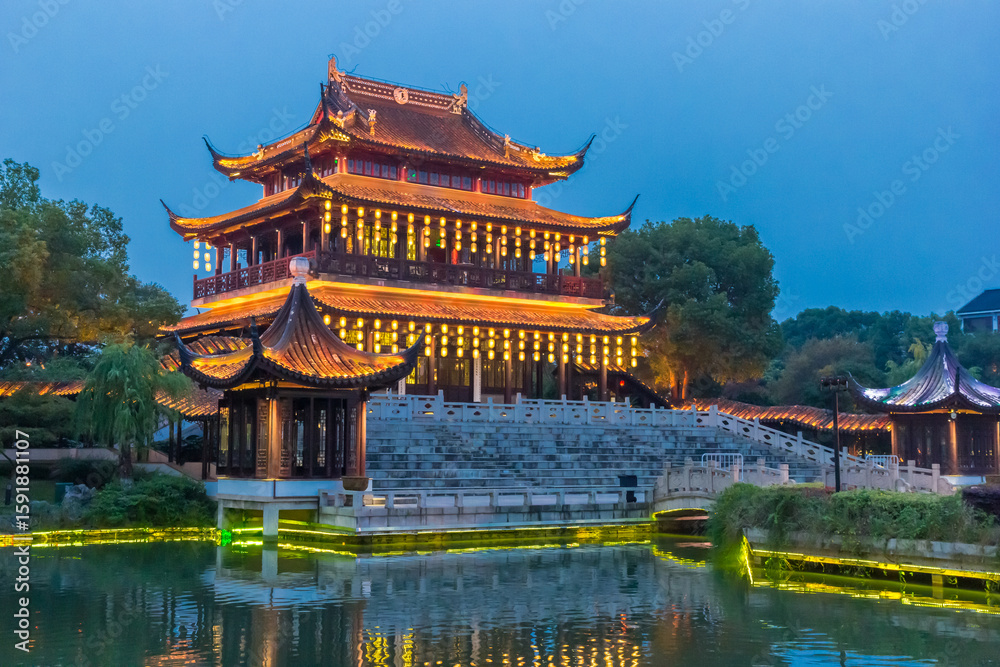 Fototapeta premium Pavillion in blue hour light in the Panmen scenic area in Suzhou, China