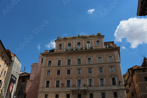 Fototapeta Naklejka Na Ścianę i Meble -  Cozy old street in Trastevere in Rome, Italy. Trastevere is rione of Rome, on the west bank of the Tiber in Rome, Lazio, Italy. Architecture and landmark of Rome Traditional ¨Rome buildings and houses