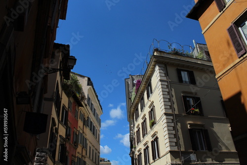 Fototapeta Naklejka Na Ścianę i Meble -  Cozy old street in Trastevere in Rome, Italy. Trastevere is rione of Rome, on the west bank of the Tiber in Rome, Lazio, Italy. Architecture and landmark of Rome Traditional ¨Rome buildings and houses