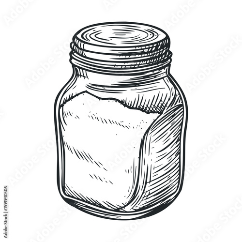 Glass jar filled with granulated sugar for kitchen use