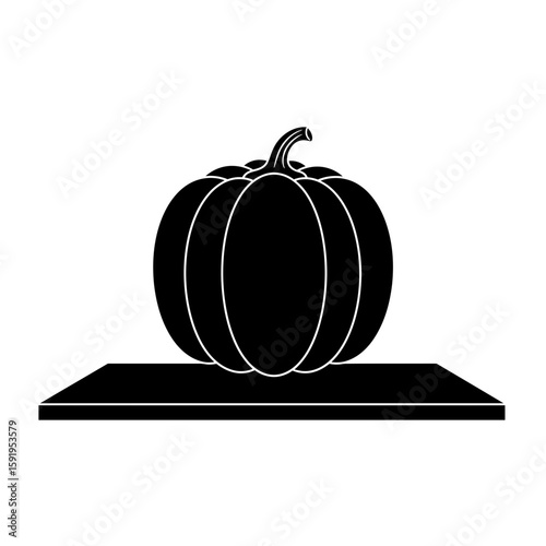 Simple black silhouette of a pumpkin on a flat surface