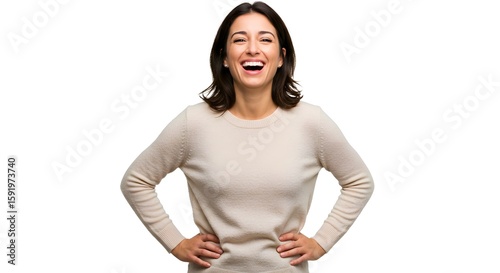 An adult woman in a casual sweater laughing heartily hands on hips on a white background