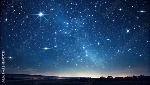 A beautiful night sky filled with countless stars shining brightly over a dark landscape view below