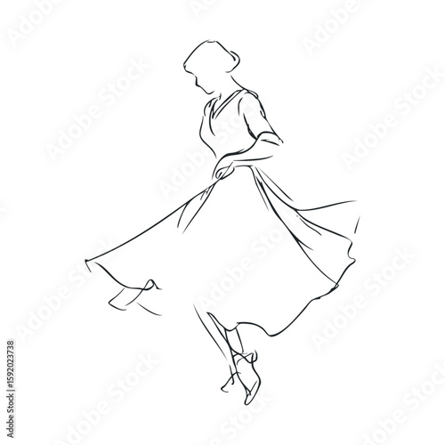Elegant dancer in flowing dress twirling gracefully on stage