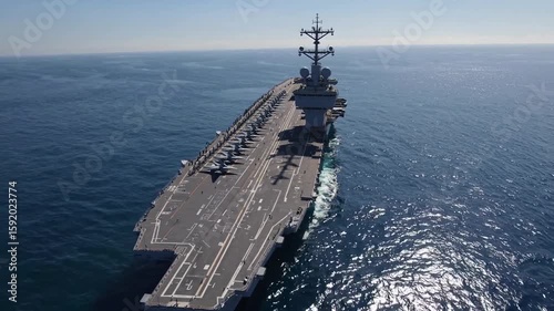 Military aircraft on deck of aircraft carrier operating in open ocean during clear weather