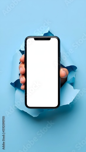Mobile phone mockup blank screen display hand holding device breaking through paper wall