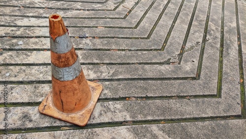 An old, worn traffic cone.
