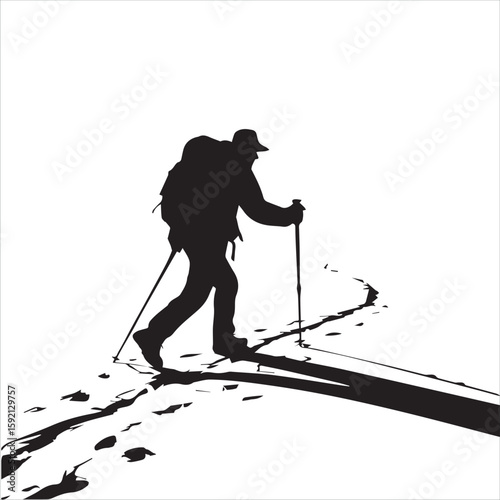 Silhouette of a hiker with backpack and poles walking on a snowy path