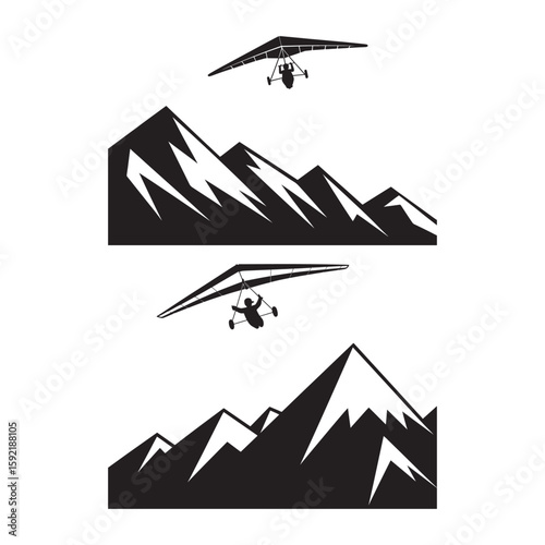 Hang glider pilot soaring over jagged mountain peaks silhouette