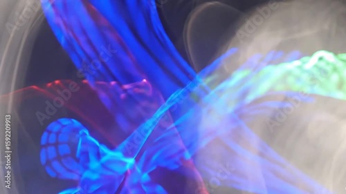 Abstract visuals of hazy, wavy light in shades of blue, purple, and a hint of green create a mysterious and calming ethereal atmosphereAbstract visuals of hazy, wavy light in shades of blue, purple, a