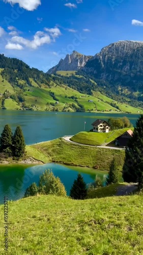 Swiss Alpine Lake and Chalet Landscape