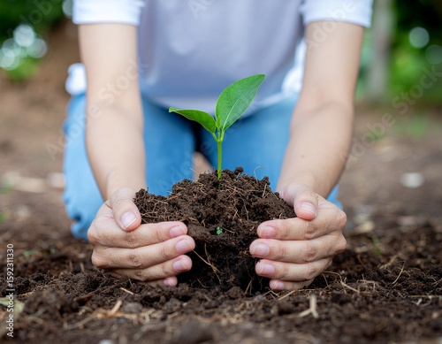 Young Person Planting Tree Outdoors, Eco-Friendly Concept with Sunshine and Community