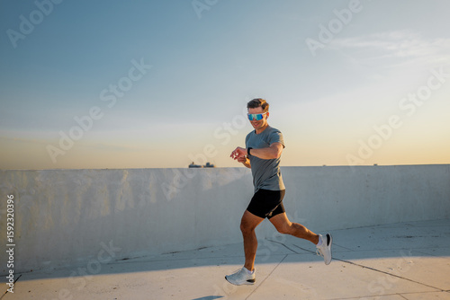 Joining the morning run under the clear blue sky on a sunlit rooftop