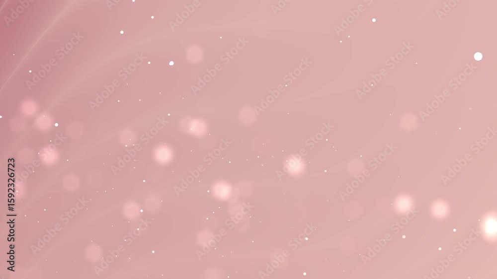 Soft pink bokeh background with scattered light particles.