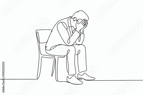 Man sitting on chair with head in hands expressing distress isolated on white background