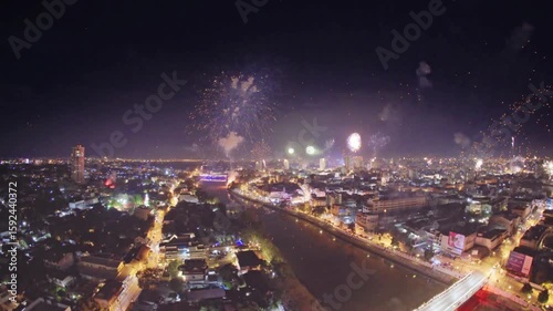 Fireworks light up the night sky over the city of chiang mai