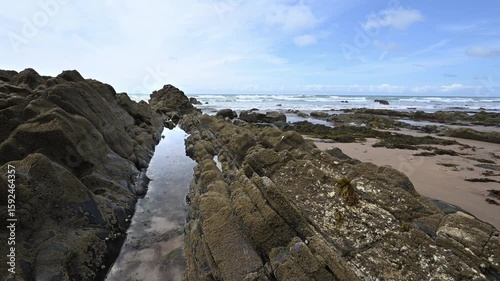 Natural beauty of rocks on Cornwall beach at low tide