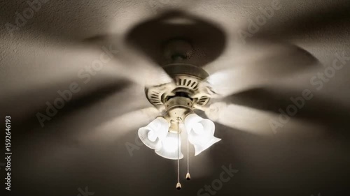 Interior Room View with Ceiling Fan in Low Light