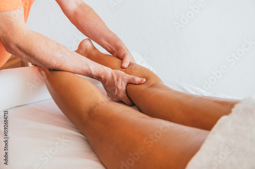 Wallpaper Mural A man massages a woman's leg Torontodigital.ca