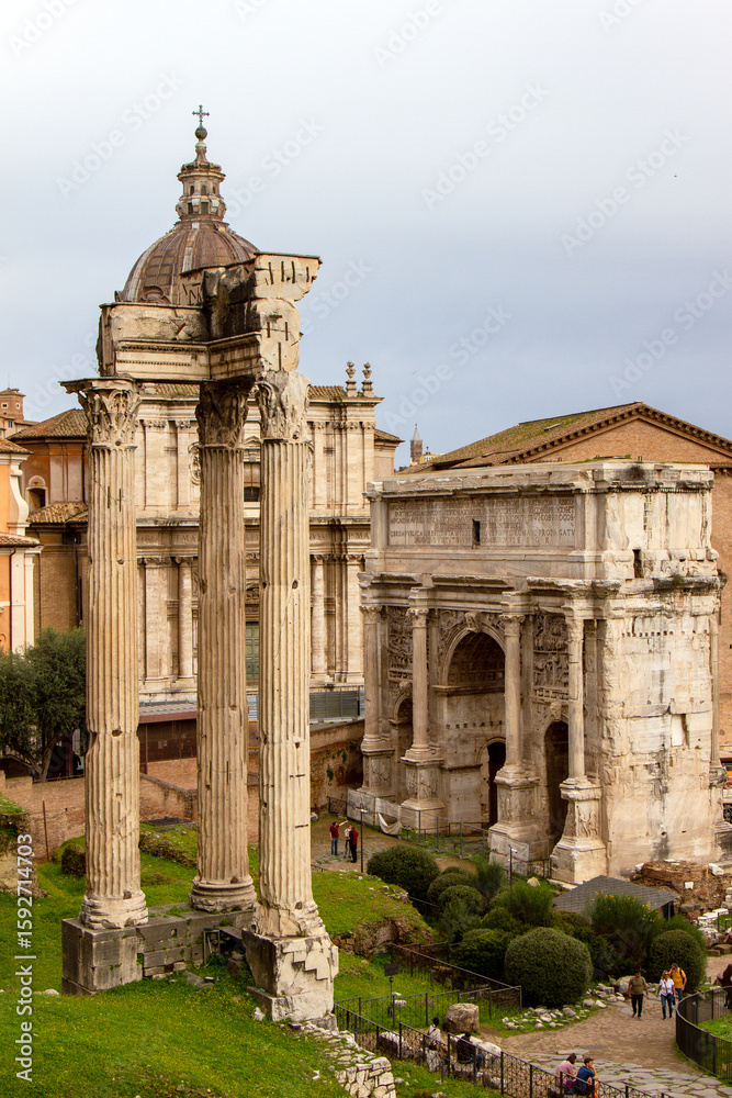 Obraz premium Picture of the Temple of Castor and Pollux and the Temple of Concord in the famous Roman Forum. The Palatine Hill, Rome, Italy.