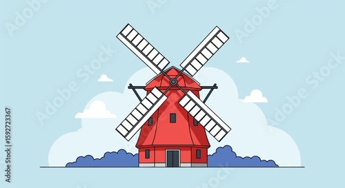 Old red windmill turning slowly under a cloudy sky in a rural landscape