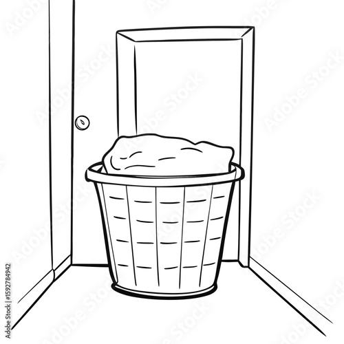 Laundry basket filled with clothes in hallway at home  