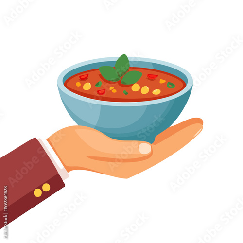 A hand holding a bowl of delicious, vibrant chili, garnished with fresh herbs