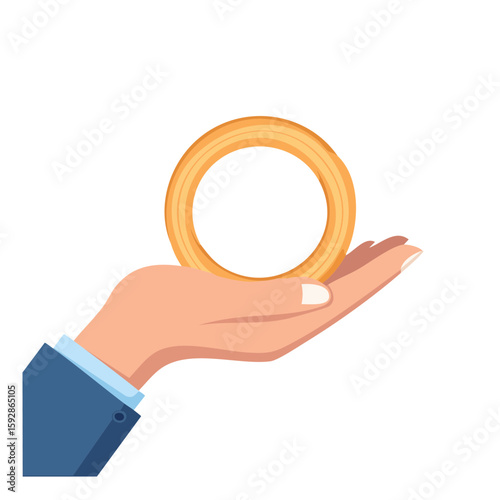 An open hand gently presenting an onion ring. The image captures a person holding an object that is round and made of gold. 