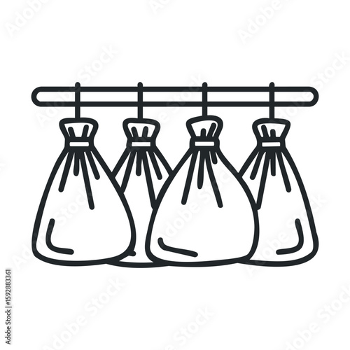 Hanging cloth bags in a kitchen for food storage and organization