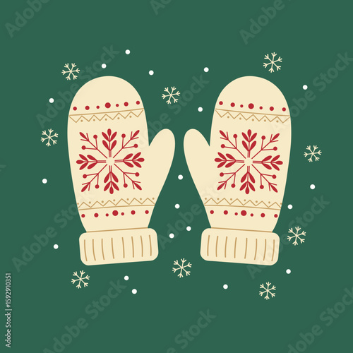 Winter mittens with snowflake pattern on green background  