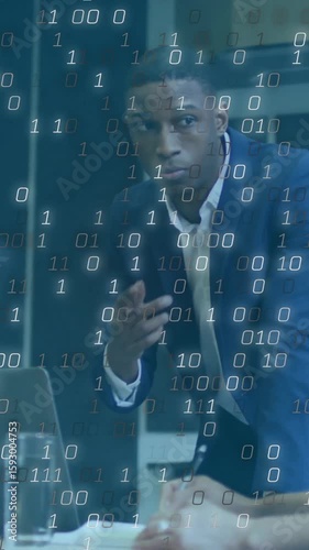 Discussing strategy, diverse professionals in business meeting with binary code overlay