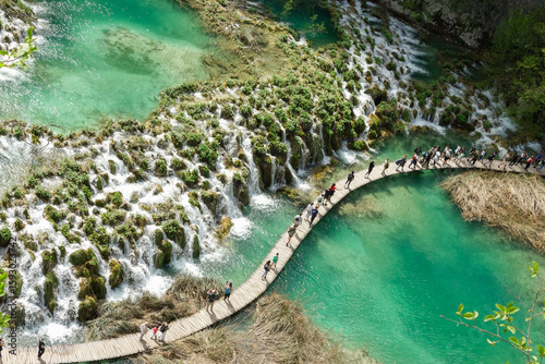 Plitvicka Jezera, Croacia - 04.20.2025: tourists walking on wooden platform of Plitvice Lakes National Park