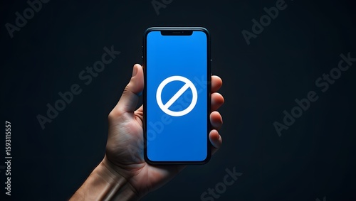 Mobile phone restriction concept hand holding smartphone with forbidden sign blue screen