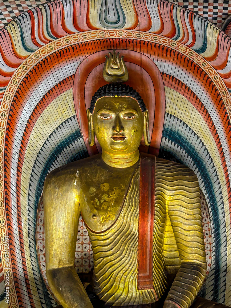 Fototapeta premium Interior of the second Cave of the Great Kings (Maharaja Viharaya), seated Buddha, Dambulla Cave temple, Sri lanka