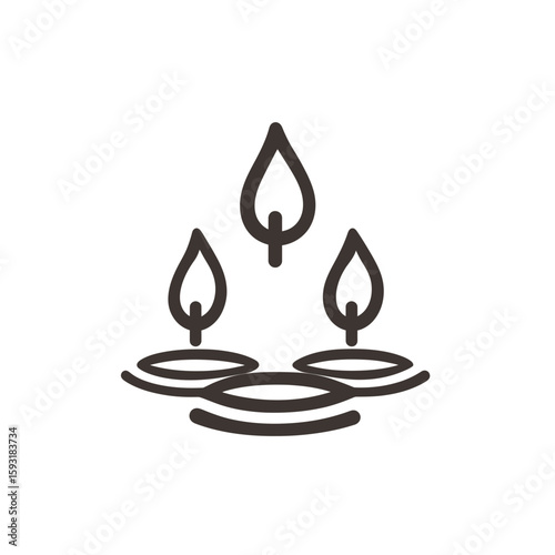 Candles glowing calmly illuminate dark room creating serene ambient mood
