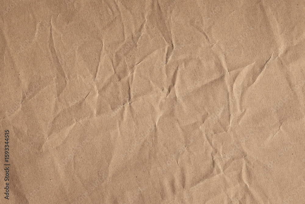 Fototapeta premium Crumpled brown craft paper texture