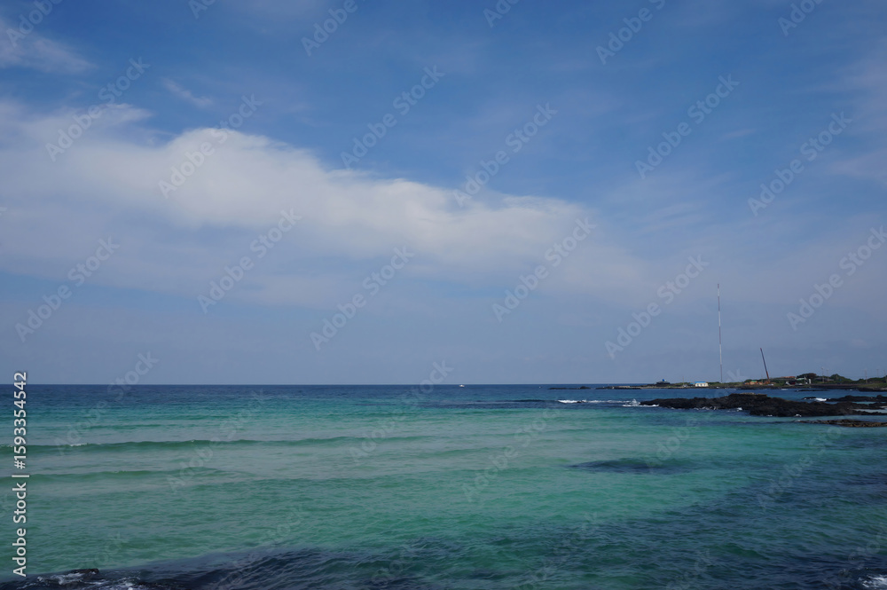 Obraz premium Serene Beach and Turquoise Sea in Jeju Island, South Korea