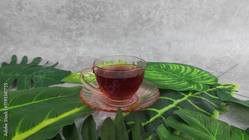 Enjoying Warm Drink with Green Leaves Relaxing Still Life