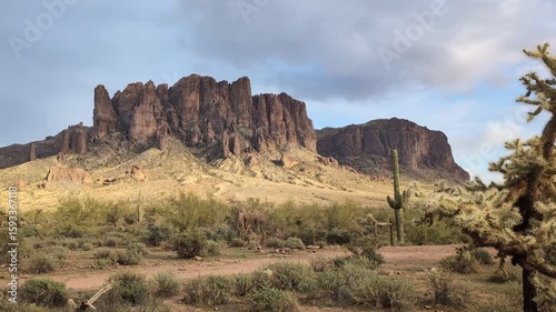 Lost Dutchman national park, Arizona desert with saguaro cactus and Superstitious Mountains at sunset. Panoramic view