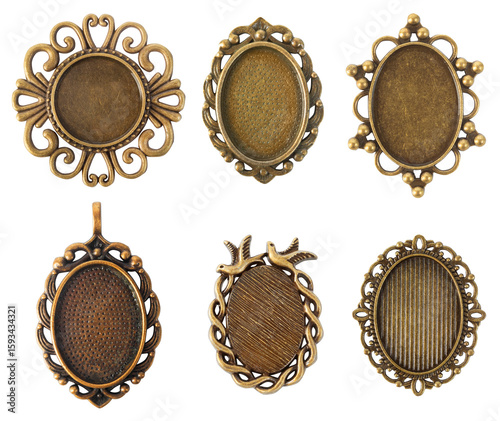 Isolated photo of vintage bronze baroque style pendants or medallions with copy space on white backdrop.
