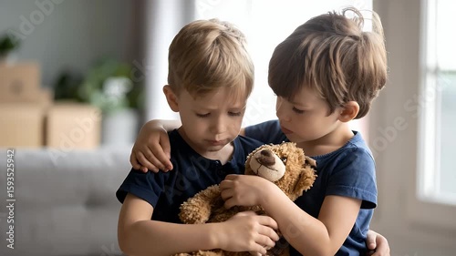 Boys Comforting Each Other With Teddy Bear