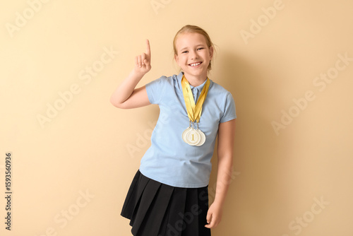 Cute little schoolgirl with...