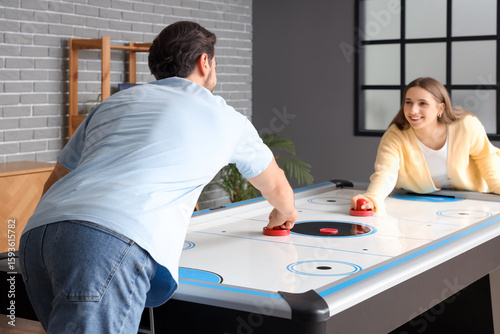 Young woman playing air hoc...