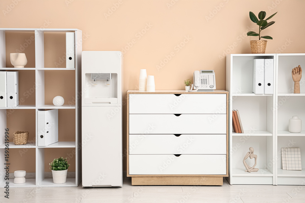 Fototapeta premium Interior of stylish office with modern water cooler and shelving units