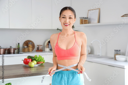 Sporty young Asian woman me...