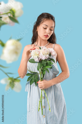 Young Asian woman with peon...